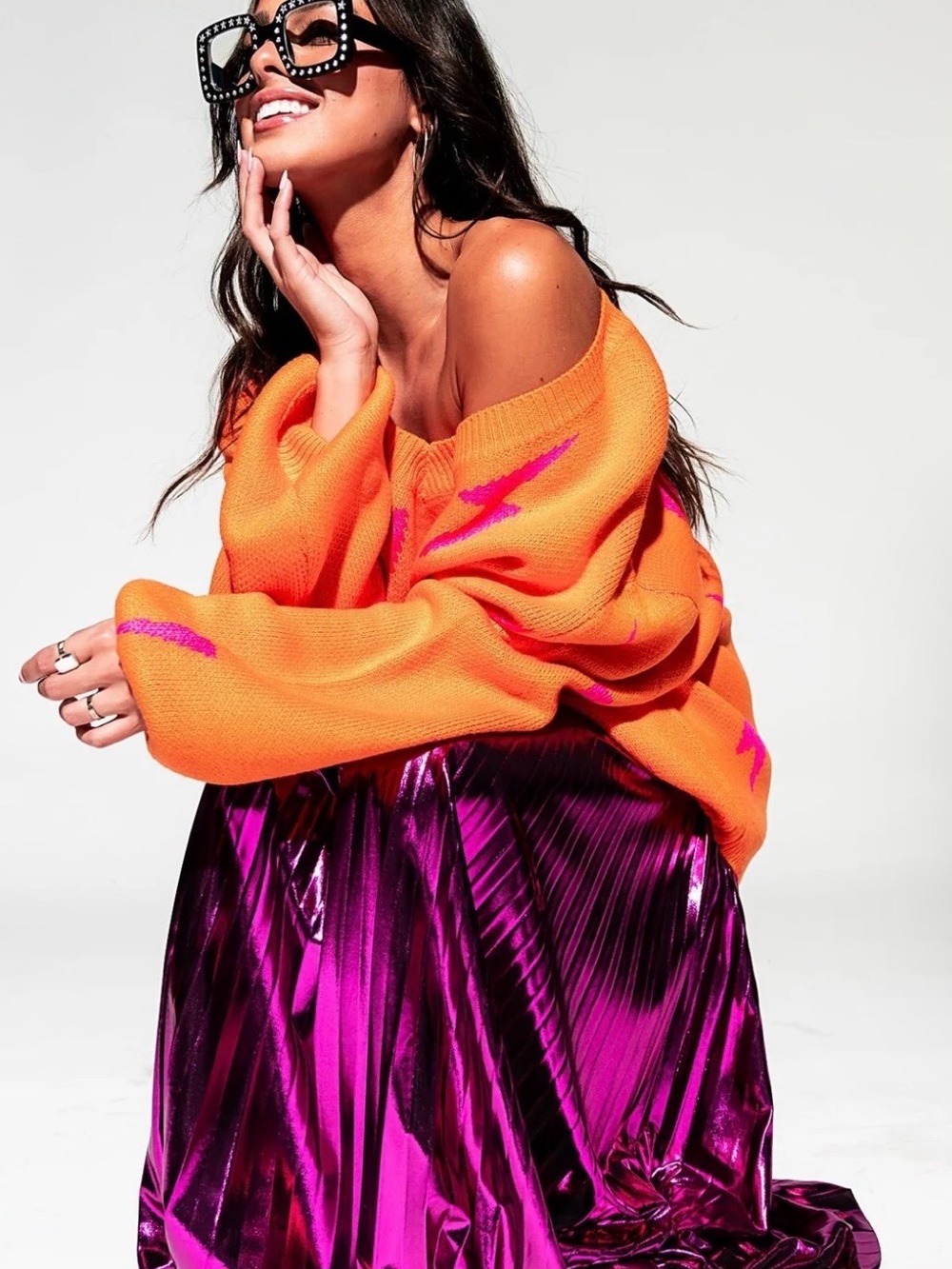 Dressed in Lala Metallic Pleated Midi Skirt in Cosmic Pink